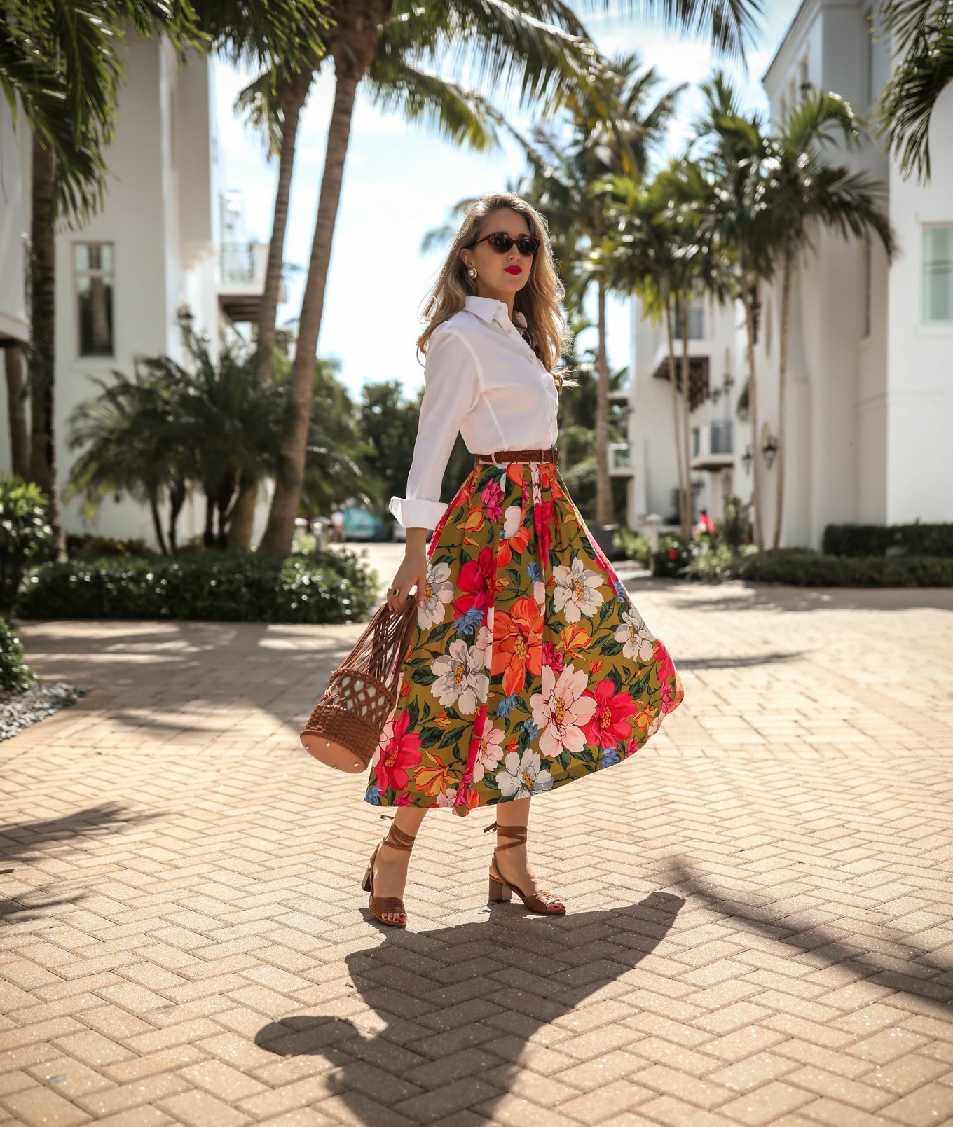 classic-beach-vacation-style-mara-hoffman-floral-midi-skirt-white-button-down-brown-woven-bag4